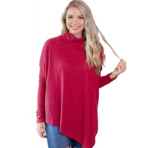 Pink asymmetrical faux poncho